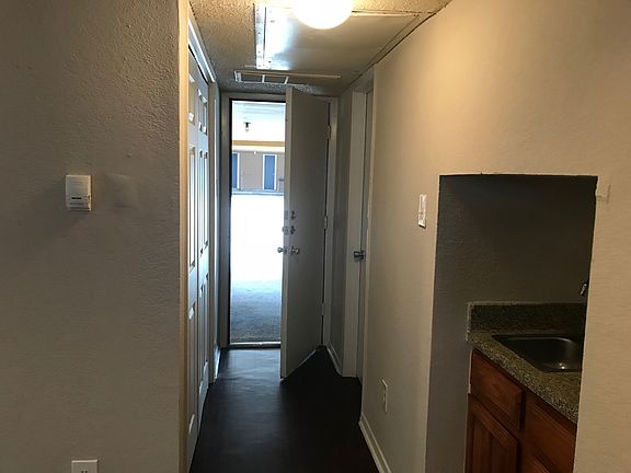 Hallway to your back door and exclusive carport. Wet bar, 1/