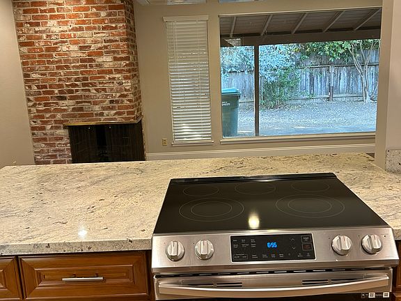 Kitchen and bar looking at living room