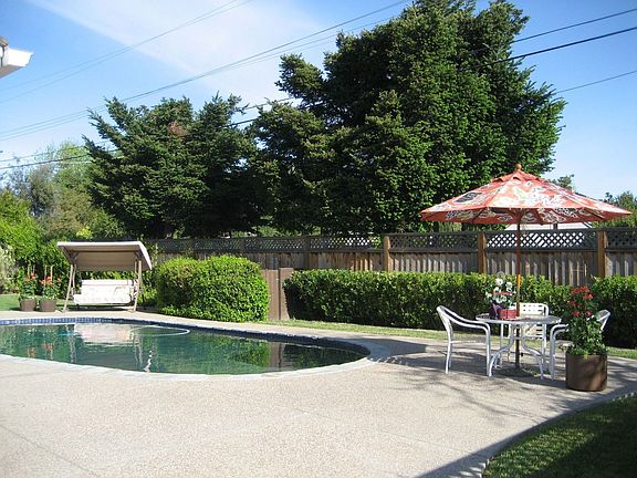 Two lawn areas & pool with Pebble-Tec finish