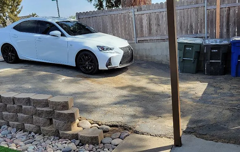 Private Driveway. Fits one car outside as pictured and one past the gates.