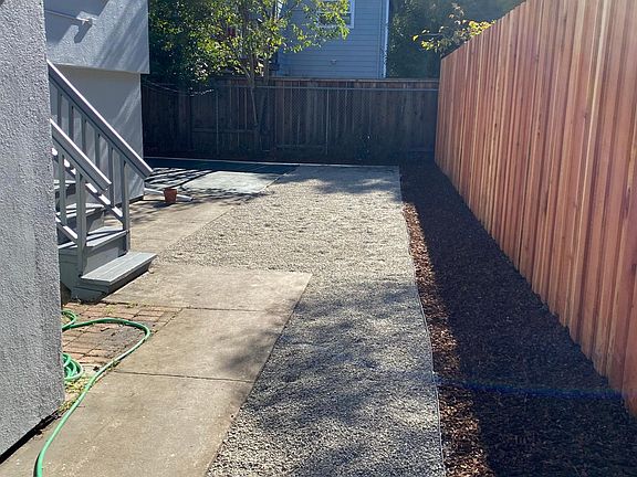 backyard walkway with mulch for planting