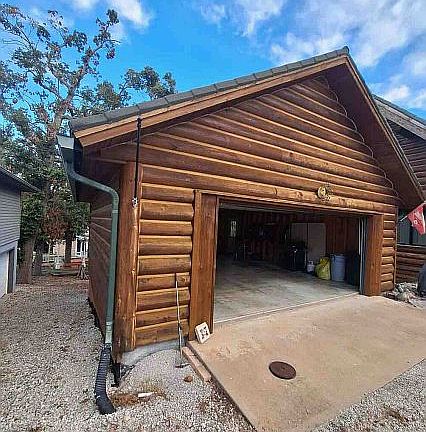 Two-car log garage.