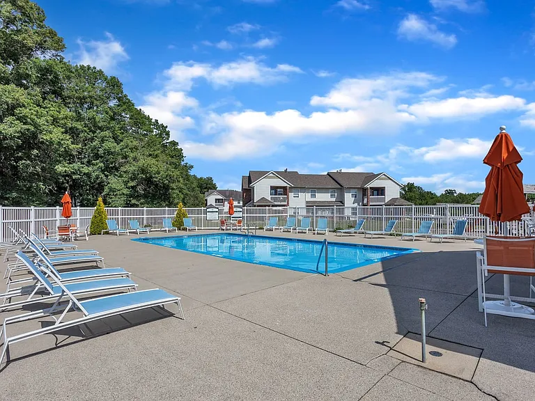 Soak up the sun at our resort-style pool featuring comfortable lounge chairs for ultimate relaxation, professionally operated by Highlands Vista Group.