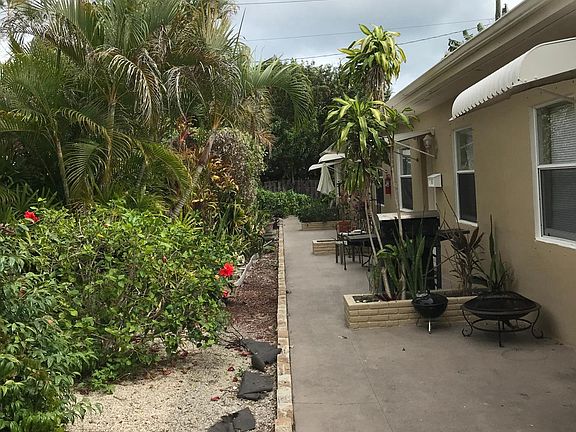 Tropical landscaping with private garden area