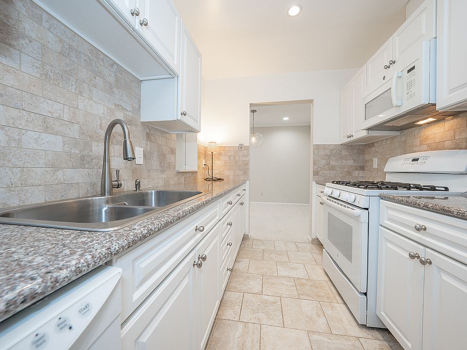 Updated kitchen with gas cooking and granite countertops