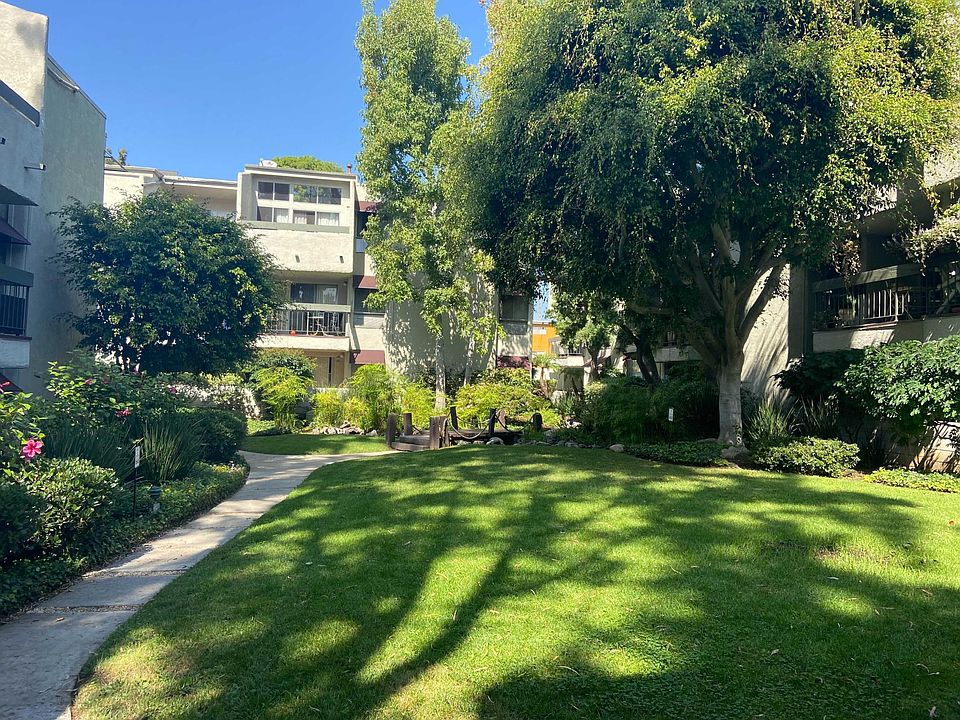 Beautifully landscaped grounds. The unit is on the 3rd floor, directly above the 2nd floor balcony visible on the right side of the photo.