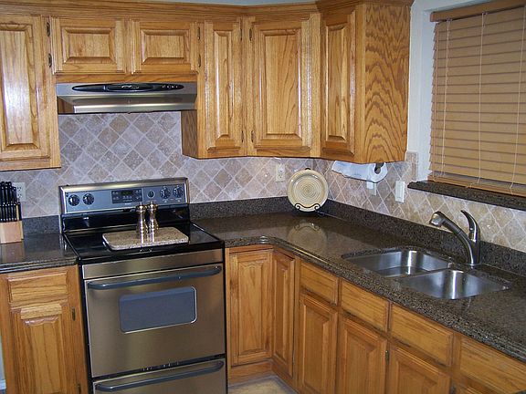 updated kitchen, new appliance, silestone counter tops and tumble rock 
