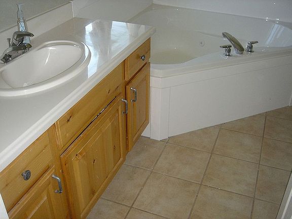 Tiled Master Bath has Jetted Tub & Separate Shower
