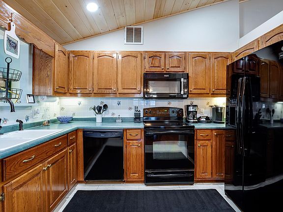 Fully stocked kitchen, dishwasher, microwave, coffee makers, stove, frige, ice machine. Extra frige and freezer in office