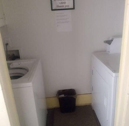 Laundry room at end of hallway for all tenants use