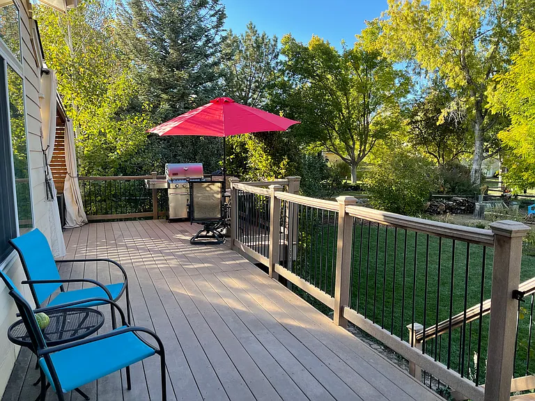 Deck with grill, table and chairs for eight