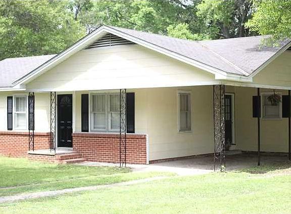 Front of home with carport.