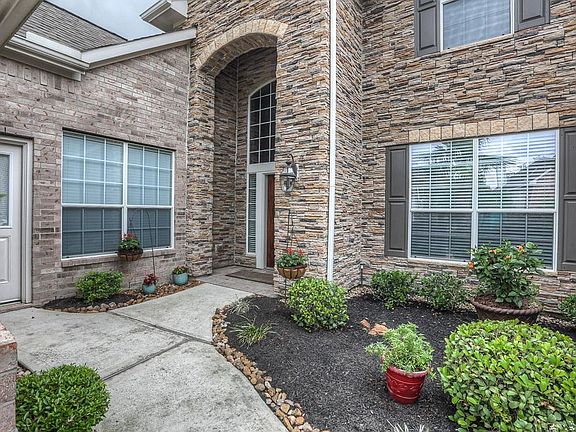 Three car garage is split with double plus a single... great for separate storage!