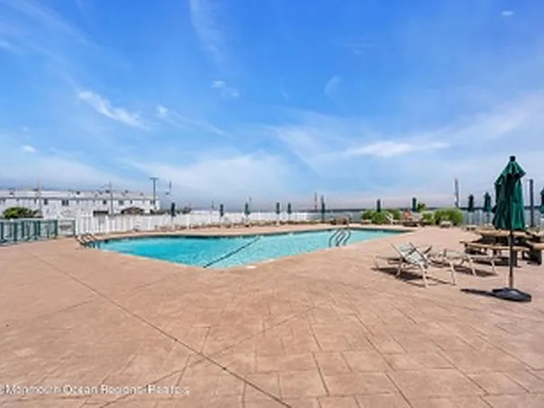 Beautiful swimming pool on oceanfront side of building