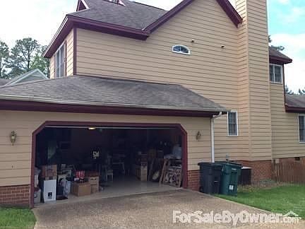Spacious 2 car garage w/shelving