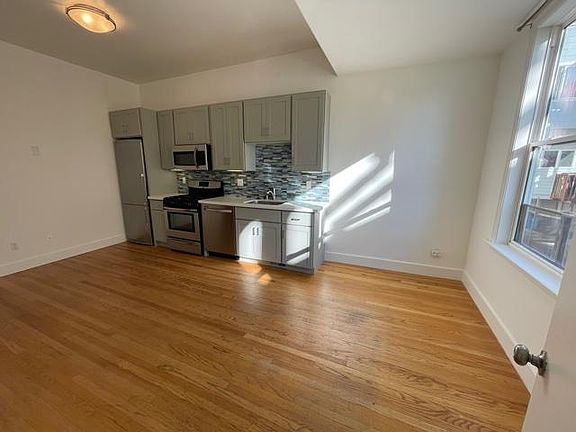 Shows large area where couch and chair and coffee table can be placed if use all rooms as bedrooms.