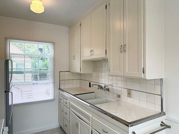 Kitchen with a large window and new blinds