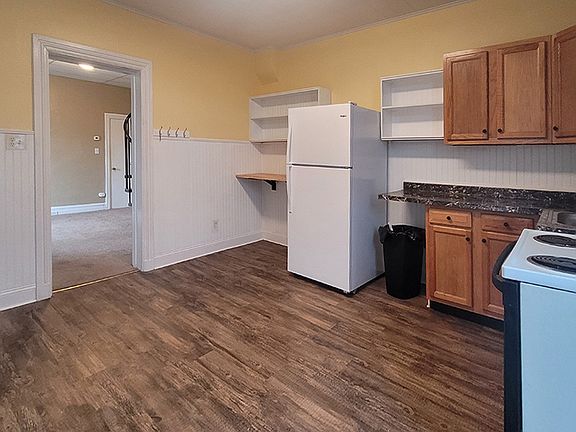 View of kitchen looking into living room.