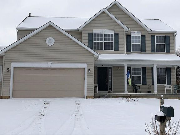 Two car attached garage has a bump out for extra storage space, as well as keyless entry and an insulted garage door which the current home owner noticed that it helped to maintain a warmer garage by at least 10 degrees, especially in these frigid tempera