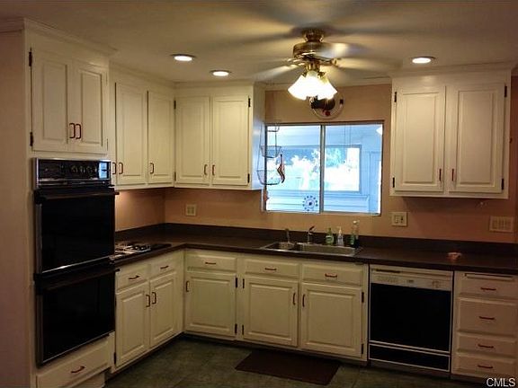 Kitchen with view out to the hot tub, screened patio and pool.