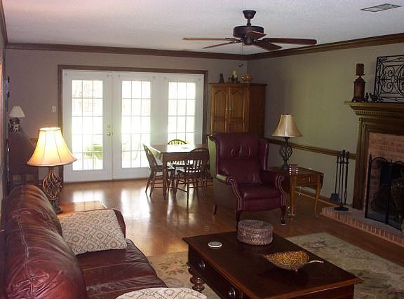 French doors lead to the patio. Great woodburning fireplace.