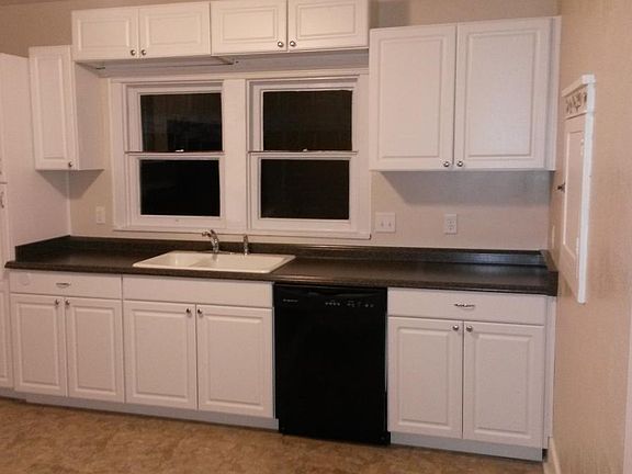 Remodeled kitchen with dishwasher and disposal.