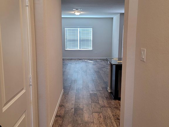 Entry hall to Kitchen/Dining/Living, wood-look luxury vinyl plank flooring