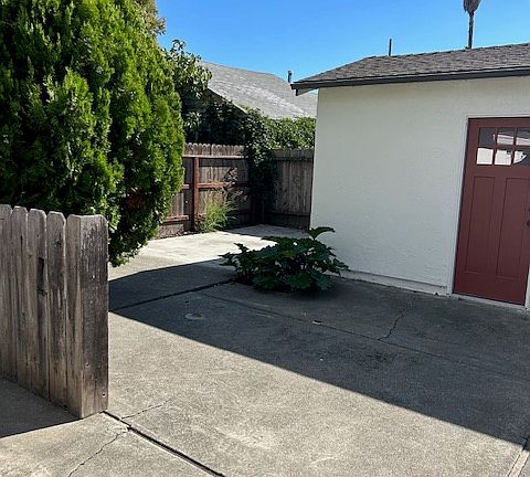 Back area of yard near detached garage.
