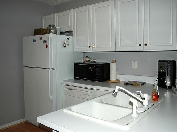 all appliances remain! Hardwood Floors in Kitchen