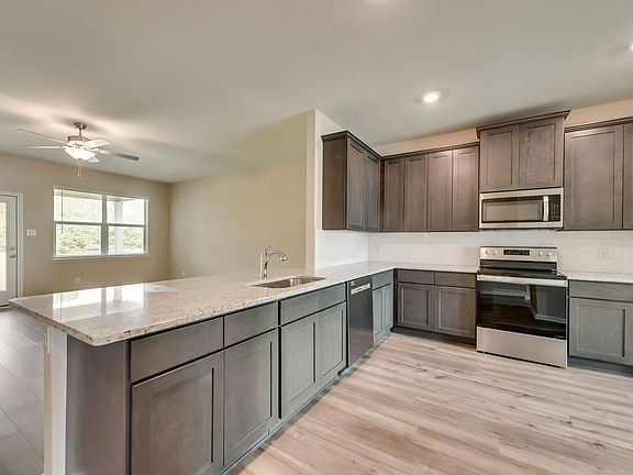 The spacious kitchen is perfect for preparing your family s favorite meals and treats.