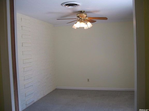The inviting dining area overlooks the back patio.  A sliding door provides access.