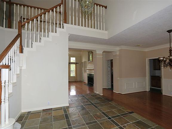 It has a very open floorplan! Just off the foyer is the dining room and living area!