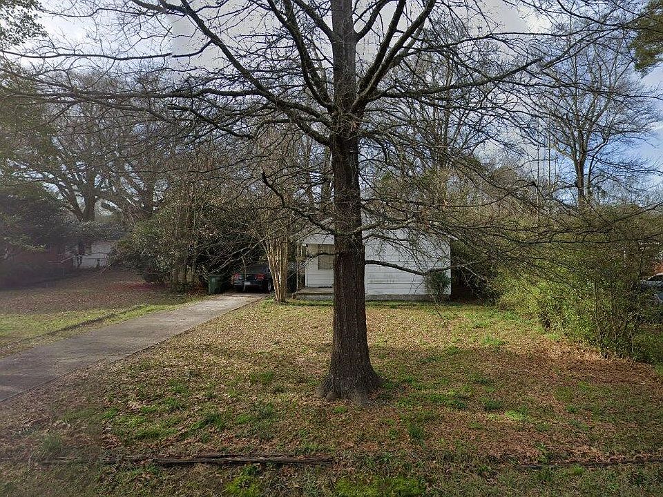 Wooded, oversized lot with detached 2 car garage with laundry area. Washer driver provided as courtesy (repairs if needed are renters' responsibility).