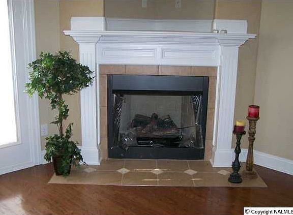 Den with Hardwoods & Gas Log Fireplace