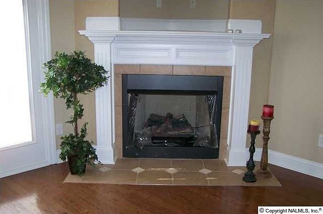Den with Hardwoods & Gas Log Fireplace