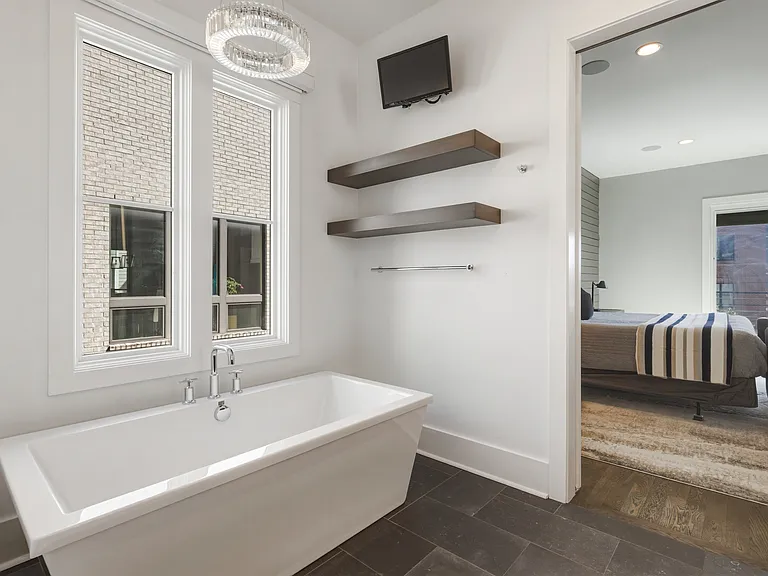 Bathroom #1 is attached to the master bedroom with a dual vanity and stand alone shower + tub. Plus a huge California closet with custom built-ins.