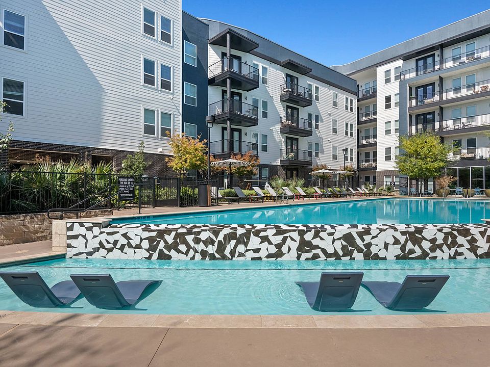 In-Water Loungers at One of Two Pools at Abstract at Design District in Dallas TX, 75207