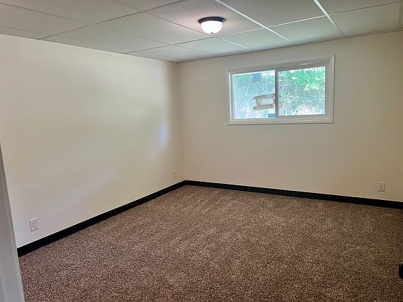 The room is nestled in the far corner of the home.