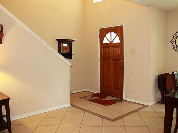 The entry greets you with easy care tile that runs through much of the ground floor.
