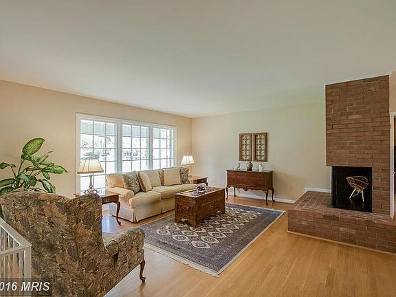 Open Living room with wood burning fireplace