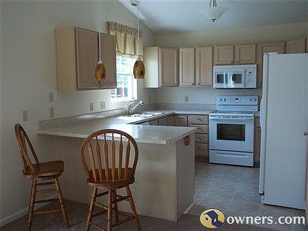 Kitchen with eat at counter, dimmable pendants