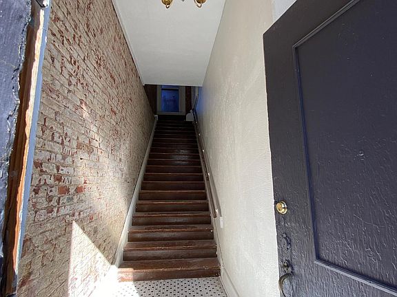 Private apartment entrance in the front of the building at street-level.