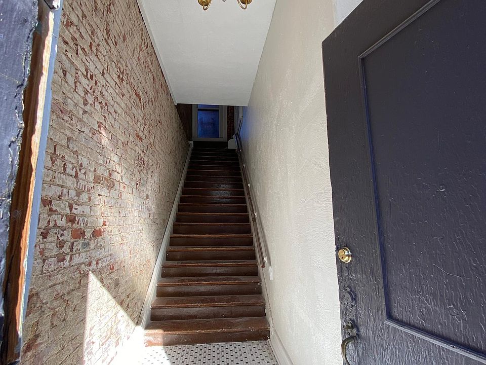 Private apartment entrance in the front of the building at street-level.