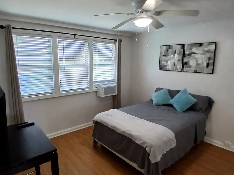 Bedroom with wall a/c.