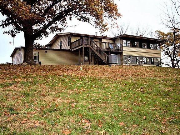 Back of the home.  Note the Sunrooms on the upper and lower parts of the home.  The views are gorgeous.