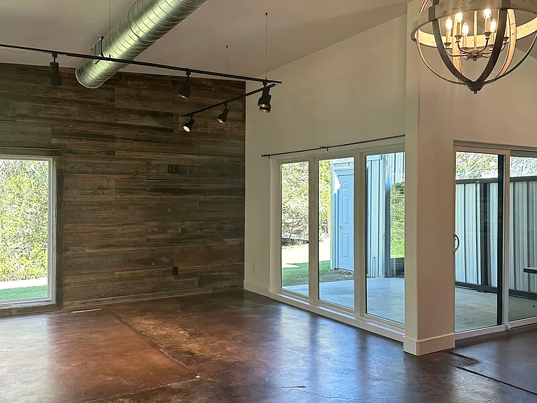 Spacious living room with beautiful view through glass on 3 sides
