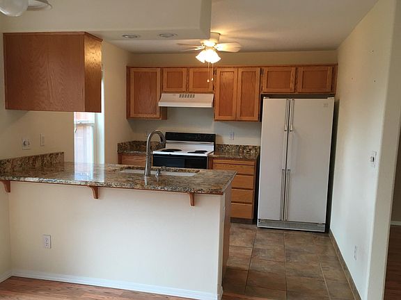 Kitchen with tile floors and granite countertops
