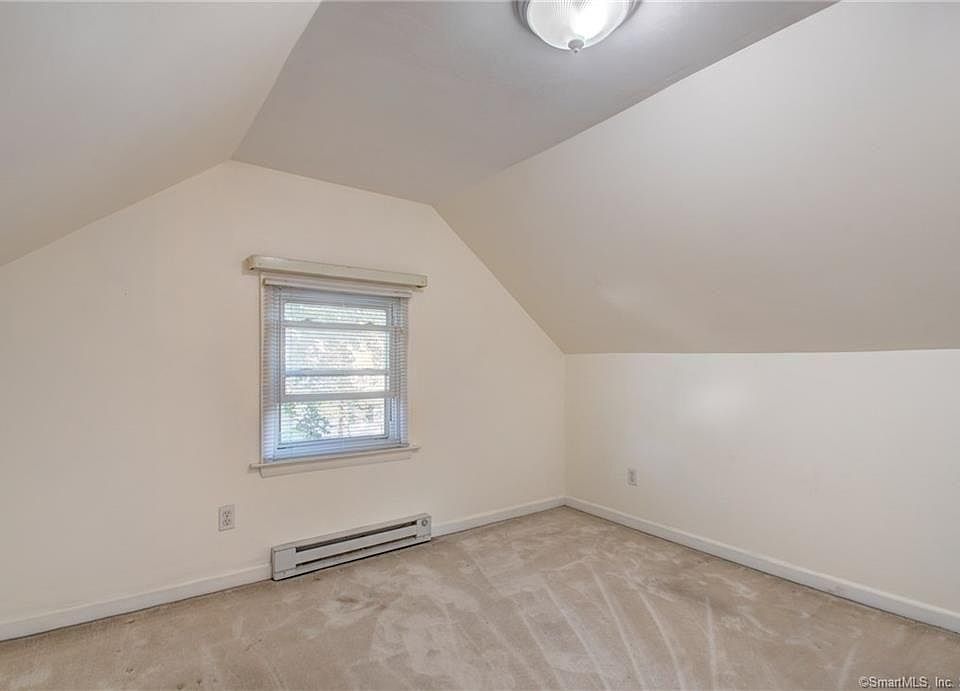 3rd floor bedroom with sitting area and full bath