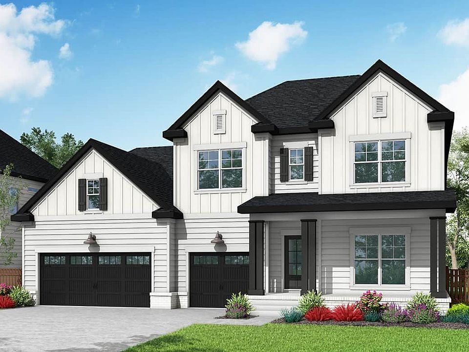 Elegant gabled roof and black shutters define this exquisite Richvale Estates residence.