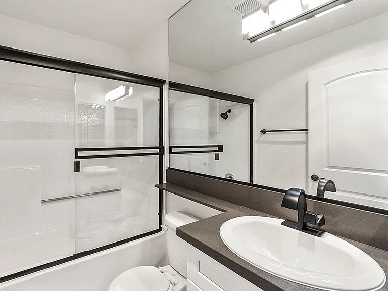 Modern styled bathroom with shower and tub.